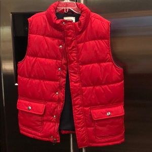 red sleeveless puffer jacket